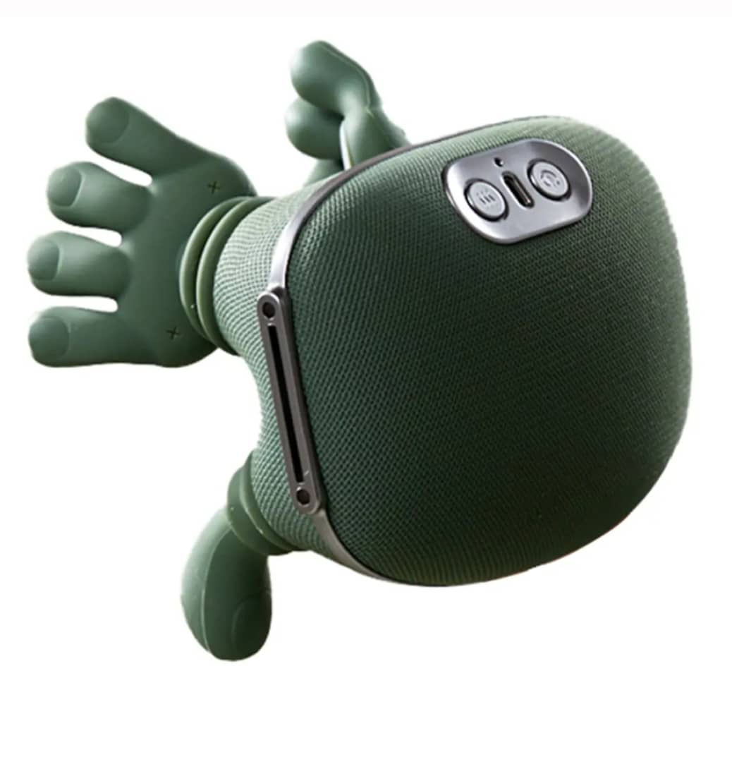 Professional comfortably using the massager while working at a laptop